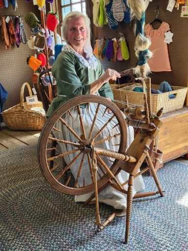 Volunteer spinning flax